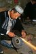 China: Crafting a highly decorative traditional hand-made knife in a small workshop in Yengisar, Xinjiang Province