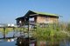 Burma / Myanmar: A stilted house at the eastern edge of Inle Lake, Shan State