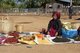 Burma / Myanmar: A Pa-O woman selling dried foodstuffs including chilli, tea and peanuts at a market near the Shwe Indein Pagoda, Indein, near Ywama, Inle Lake, Shan State