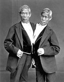 Chang and Eng Bunker (May 11, 1811 – January 17, 1874) were Thai-American conjoined twin brothers whose condition and birthplace became the basis for the term 'Siamese twins'.<br/><br/>

The Bunker brothers were born on May 11, 1811, in the province of Samutsongkram, near Bangkok, in the Kingdom of Siam (today's Thailand). Their fisherman father was a Chinese Thai, while their mother was a Chinese Malaysian. Because of their Chinese heritage, they were known locally as the 'Chinese Twins'. The brothers were joined at the sternum by a small piece of cartilage, and though their livers were fused, they were independently complete.<br/><br/>

In 1829, Robert Hunter, a Scottish merchant who lived in Bangkok, saw the twins swimming and realized their potential. He paid their parents to permit him to exhibit their sons as a curiosity on a world tour. When their contract with Hunter was over, Chang and Eng went into business for themselves. In 1839, while visiting Wilkesboro, North Carolina, the brothers were attracted to the area and purchased a 110-acre (0.45 km2) farm in nearby Traphill.<br/><br/>

Determined to live as normal a life they could, Chang and Eng settled on their small plantation and bought slaves to do the work they could not do themselves. Using their adopted name 'Bunker', they married local women on April 13, 1843. Chang wed Adelaide Yates, while Eng married her sister, Sarah Anne. Chang and Adelaide would become the parents of eleven children. Eng and Sarah had ten. The twins also became naturalized American citizens.<br/><br/>

On January 17, 1874, Chang died while the brothers were asleep. Eng awoke to find his brother dead and cried, 'Then I am going'. A doctor was summoned to perform an emergency separation, but he was too late. Eng died approximately three hours later.