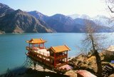 Tian Chi or ‘Heaven Lake’ is 110km east of Urumqi. The long, blue lake is at an altitude of 2,000m and lies in the lee of permanently snow-capped Bogda Feng, ‘The Peak of God’, at 5,445m the highest mountain in the eastern Tian Shan.<br/><br/>

During the summer months Kazakh yurts cluster by the lake shore. In winter even the hardy Kazakhs move down to lower pastures.