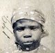 This photograph of a 'Liberated African' slave was taken after they were freed from slaving ships by the British Navy. From 1861 to 1874, more than 2500 'Liberated Africans' were shipped to Port Victoria, Seychelles.<br/><br/>

While the Slave Trade continued across eastern and southern Africa and the Indian Ocean, the 'liberated' were taken to a depot, classified by the District Magistrate, photographed, renamed, and assigned as 'apprentices' to the French-owned plantations, where they were indentured for five years.