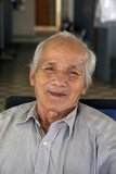 Born in 1941, Bou Meng is one of 14 survivors of S-21, the Khmer Rouge prison in Phnom Penh (1975–1979), Cambodia, where more than 16,000 people were tortured and then sent to be killed. He survived because of his skill at portraiture and was forced to paint images of the Khmer Rouge leaders.