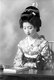 Japan: Portrait of a <i>geisha</i> reading a book, 1938