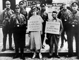 The woman's sign reads: 'I am the biggest pig in the town and only get involved with Jews!', and the man's sign reads: 'As a Jewish boy, I only go to bed with German girls'. The man is thought to be Oskar Dankner, owner of a cinema in Cuxhaven.