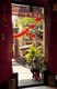 Vietnam: A woman sits in the entrance to the Assembly Hall of the Cantonese Chinese Congregation (Quang Trieu), Hoi An