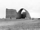 Iraq: Ruins of Taq Qasra at Ctesiphon, with the great Arch of Ctesiphon after the collapse of the right-hand facade, 1932