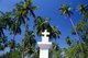 India: A Christian crucifix in front of coconut palms on a Goan beach, Goa
