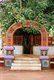 India: A holy bodhi tree (<i>Ficus religiosa</i>) in front of the entrance to the Hindu Shri Damodar Temple, Zambaulim, Goa