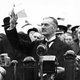 UK: 'Peace for Our Time'. Neville Chamberlain (1869-1940) holds the paper signed by both Hitler and himself on his return from Munich to Heston Aerodrome, 30 September 1938