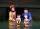 Vietnam: Puppeteers taking a bow at the Thang Long Water Puppet Theatre, Hanoi