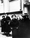 Kristallnacht or 'Crystal Night', also referred to as the Night of Broken Glass, was a pogrom against Jews throughout Nazi Germany and Austria that took place on 9–10 November 1938, carried out by SA (Sturmabteilung or Brownshirts) paramilitary forces and German civilians.<br/><br/>

German authorities looked on without intervening. The name Kristallnacht comes from the shards of broken glass that littered the streets after Jewish-owned stores, buildings, and synagogues had their windows smashed.