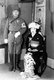 Japan: A member of the <i>Kempeitai</i>i secret police wearing the <i>Kenhei</i> military police armband poses for a portrait with his wife, c. late 1930s