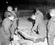USA / Germany: Gen. Dwight D. Eisenhower, Supreme Allied Commander, and Gen. Omar N. Bradley, CG, 12th Army Group, examine a suitcase of silverware, part of German loot stored in Merkers salt mine, 12 April, 1945