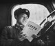 China: Communist role model Lei Feng reading Chairman Mao, c. 1963