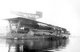 Japan: Imperial Japanese Navy aircraft carrier <i>Kaga</i> being fitted out in 1928. Note the distinctive long funnel below the flight deck and the three 8-inch guns in casemates
