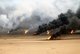 Kuwait: Oil well fires rage outside Kuwait City in the aftermath of Operation Desert Storm. The wells were set on fire by Iraqi forces before they were ousted from the region by coalition forces, 21 March 1991