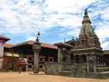 That the Durbar Square of Bhaktapur appears so much less cluttered than its counterparts in Kathmandu and Patan is simply due to the earthquake of 1934. The earthquake devastated a large number of buildings in the square and they were never reconstructed.<br/><br/>

A minor earthquake in 1988 did further damage. According to the Nepalese chronicles, Bhupatindra Malla had laid out 99 courtyards within the palace compound; in 1742, only 12 remained, and today there are but six.<br/><br/>

The Vatsala Temple, a few metres southeast of the Bhupatindra Pillar, was built in 1672 CE by Jagatprakasha Malla. Its most conspicuous feature is a bell, about four feet high and set in a massive stone frame, which was added by Ranajit Malla in 1737. The bell was rung to call the faithful to the morning prayers conducted for the goddess Taleju.
