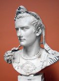 Born Gaius Julius Caesar Germanicus, Caligula was the nephew and adopted son of Emperor Tiberius, making him part of the Julio-Claudian dynasty. He earned the nickname 'Caligula' (little solder's boot) while accompanying his father, Germanicus, during his campaigns in Germania.<br/><br/>

His mother, Agrippina the Elder, became entangled in a deadly feud with Emperor Tiberius that resulted in the destruction of her family and leaving Caligula the sole male survivor. After Tiberius' death in 37 CE, Caligula succeeded his grand uncle as emperor. Surviving sources of his reign are few and far between, but he is often described as initially being a noble and moderate ruler before descending into tyranny, cruelty, sadism, extravagance and sexual perversity.<br/><br/>

Caligula was eventually assassinated in 41 CE by a conspiracy of courtiers, senators and officers within his own Praetorian Guard, who murdered him and his family. Attempts by some of the conspirators to re-establish the Roman Republic were thwarted when the Praetorian Guard immediately decalared Caligula's uncle, Claudius, the new emperor.