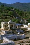 The Jain's sacred site of Shatrunjaya contains hundreds of Palitana temples. The Shatrunjaya Hills were sanctified when Rishabha, the first <i>tirthankara</i> (omniscient Teaching God) of Jainism, gave his first sermon in the temple on the hill top. The ancient history of the hills is also traced to Pundarika Swami, a chief Ganadhara and grandson of Rishabha, who attained salvation here. His shrine located opposite to the main Adinath temple, built by his son Bharata, is also worshiped by pilgrims.