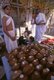 India: Coconuts, some with coins attached, are used as offerings in the holy Jain Palitana temples (11th to 16th Century CE) in the Shatrunjaya Hills, Gujarat (2004)