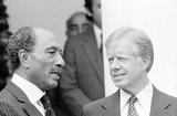 James Earl 'Jimmy' Carter Jr. (born October 1, 1924) is an American politician who served as the 39th President of the United States from 1977 to 1981. In 2002, he was awarded the Nobel Peace Prize for his work with the Carter Center.<br/><br/> 

Muhammad Anwar Al Sadat (25 December 1918 – 6 October 1981) was the third President of Egypt, serving from 15 October 1970 until his assassination by fundamentalist army officers on 6 October 1981. He led the War of 1973 against Israel, making him a hero in Egypt and, for a time, throughout the Arab World. Afterwards he engaged in negotiations with Israel, culminating in the Egypt-Israel Peace Treaty. This won him the Nobel Peace Prize but also made him unpopular among some Arabs, resulting in a temporary suspension of Egypt's membership in the Arab League, and eventually his assassination.