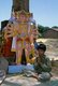 India: A young boy in front of a figure of the demon god Ravana (a character in the Hindu epic, the <i>Ramayana</i>) in a village near Indore, Madhya Pradesh