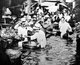 China: Shoppers waist-deep in water during the great Yellow River Flood of 1931