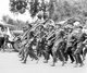 China: Military clean up crew marching to begin the hard work of rescue and repair after the Great Tangshan Earthquake, 28 July 1976