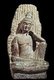 China: The Bodhisatta Avalokitesvara (Guanyin) sitting on Mount Potalaka, Song Dynasty limestone statue. Guimet Museum, Paris