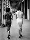 China:Two fashionably dressed women wearing <i>qipao</i> dresses (<i>cheongsam</i>) stroll down a Shanghai street, 1948