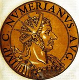 Numerian (-284) was the son of Emperor Carus and older brother to Carinus, who he would be joint emperor with in later life. Carus immediately elevated both Carinus and Numerian to Caesars after his ascension to the throne, taking Numerian east with him to wage war against the Sassanid Empire while Carinus was left in charge of the West.<br/><br/>

Carus soon died after becoming emperor, making Numerian and Carinus the new emperors. While Carinus rushed back to Rome, Numerian lingered in the East, returning at a leisurely and ordered pace, unworried by the Persians due to their own internal issues. However, disaster struck on the way back.<br/><br/> 

While travelling through Asia Minor, Numerian began suffering from an inflammation of the eyes and had to travel by closed coach. Somewhere near Bithynia, Numerian's soldiers began smelling an odd odour coming from the coach, like that of a decaying corpse. They opened the coach's curtains to find Numerian dead within.