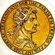 Marcus Ulpius Traianus, Trajan, was born in the province of Hispania Baetica in 53 CE, to a non-patrician family. He rose to prominence during Domitian's reign, and fought in numerous campaigns. He was adopted as Nerva's heir and successor in 97 CE, the emperor compelled to do so by the Praetorian Guard. Trajan became emperor in 98 after his predecessor's death.<br/><br/>

Trajan is considered one of the greatest emperors of the Roman Empire, with the senate officially declaring him 'optimus princeps', or 'best ruler'. He was a highly successful soldier-emperor who led the greatest military expansion in Roman history, with the empire reaching its maximum territorial extent under his rule. He was also known for his philanthropic rule and extensive building programmes, reshaping Rome and leaving numerous landmarks behind.<br/><br/>

His beneficent and prosperous reign earned him an enduring reputation that has survived throughout the centuries, and he has been deified as the second of the 'Five Good Emperors'. He died of a stroke in 117 after almost 20 years of rule, and was succeeded by his adopted heir Hadrian.