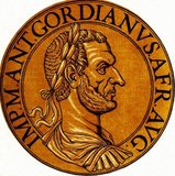 Gordian I (159-238) was born into a family of Equestrian rank, though there is little else known about his early life. He rose to power late during the reign of Emperor Alexander Severus, eventually becoming governor of the Roman province of Africa in 237.<br/><br/>

When Alexander was killed and replaced by Maximinus Thrax, many were discontented with his rule, especially the Roman Senate, who viewed Maximinus with severe disdain and did not consider him a true Roman. This discontent eventually resulted in a revolt in Africa in 238. The rioters declared Gordian I the new emperor, who only accepted if his son, Gordian II, was also accepted as co-emperor. The Senate was quick to recognise the Gordians as the true emperors of the Empire, in defiance of Maxminius.<br/><br/>

Their co-rule only lasted 21 days though, before a legion from the neighbouring province of Numidia invaded the province of Africa and easily defeated the hastily established militia army. Gordian II was killed during the Battle of Carthage, and Gordian I hanged himself after hearing of his son's death. His legacy would live on through his grandson Gordian III, who was recognised as emperor by the end of 238.