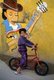 India: A young boy poses in front of a wall mural, Diu, union territory of Daman and Diu (1998)