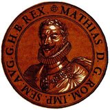Matthias (1557-1619) was the son of Emperor Maximilian II and younger brother of Emperor Rudolf II. He married his cousin, Archduchess Anna of Austria, becoming successor to his uncle, Archduke Ferdinand II. He was invited to the Netherlands by the rebellious provinces and offered the position of Governor-General in 1578, which he accepted despite the protestations of his uncle, King Philip II of Spain.<br/><br/> 

Matthias helped to set down the rules for religious peace and freedom of religion, and only returned home in 1581 after the Netherlands deposed Philip II to become fully independent. He became governor of Austria in 1593 by his brother Rudolf's appointment. He forced his brother to allow him to negotiate with the Hungarian revolts of 1605, resulting in the Peace of Vienna in 1606. He then forced his brother to yield to him the crowns of Hungary, Austria and Moravia in 1608, and then making him cede the Bohemian throne in 1611. By then Matthias had imprisoned his brother, where he remained till his death in 1612.<br/><br/>

After Rudolf's death, Matthias ascended to Holy Roman emperor, and had to juggle between appeasing both the Catholic and Protestant states within the Holy Roman Empire, hoping to reach a compromise and strengthen the empire. The Bohemian Protestant revolt of 1618 provoked his strongly Catholic brother Maximilian III to imprison Matthias' advisors and take control of the empire, Matthias being too old and ailing to stop him. Matthias died a year later in 1619.