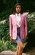 Thailand: Thai silk is one of the country's finest products. Here a model wears a stylish pink silk jacket and grey silk skirt, Chiang Mai