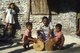 Maldives: A father instructs his two sons in the use of traditional drums, Addu Atoll (Seenu Atoll) 1980