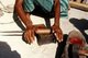 Maldives: Lacquer workers preparing lacquer, Thulhaadhoo Island, Baa Atoll. This is the only island in the Maldives doing lacquer work, 1980