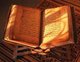 Maldives: Late afternoon sunlight falls on a handwritten Koran on an antique wooden book stand or <i>rehal</i> (X-shaped foldable book rest) atop a fine grass <i>kunaa</i> mat