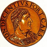 Magnus Decentius (-353) was possibly the brother of the usurper Magnentius, who murdered Emperor Constans and revolted against Emperor Constantius II in 350. When Magnentius was busy fighting against Constantius II, he elevated Decentius to Caesar and co-emperor to aid him, ordering him to oversee the defence of Gaul and the Rhine frontier.<br/><br/>

Magnentius was eventually defeated by Constantius at the Battle of Mons Seleucus in 353, and committed suicide by falling on his own sword. When Decentius heard of this, as he was leading reinforcements to aid his brother, he hanged himself at Senonae rather than continue fighting.