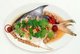 Thailand: Pompano fish cooked in a plum sauce and accompanied by chilli peppers, ginger and lemongrass