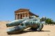 Italy: Icarus fallen to earth (bronze statue by Polish sculptor Igor Mitoraj, 1944 - 2014) lies in front of the Temple of Concordia  (c. 440 - 430 BCE), Valley of the Temples (Valle dei Templi), Agrigento, Sicily