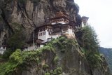 Paro Taktsang, also known by the names Taktsang Palphug Monastery and the Tiger's Nest, is a major Buddhist sacred site and temple complex built into the 1,000-metre (3,281-foot) cliffside of the upper Paro valley in Bhutan. The elegant structure is perhaps the most well known cultural icon of Bhutan.<br/><br/>

The monastery first began construction in 1692 around Taktsang Senge Samdup, a cave where the 8th-century Buddhist sage Padmasambhava, also known as Guru Rinpoche, was said to have meditated in for three years, three months, three days and three hours; Guru Rinpoche is credited for introducing Buddhism to Bhutan, acting as a tutelary deity for the country.<br/><br/>

The name Taktsang, which literally translates to "Tigress Lair", comes from the supposed fact that Guru Rinpoche flew to the cave from Tibet on the back of a tigress, who in some legends is said to have been the former wife of an emperor and a disciple of the Guru, named Yeshe Tsogyal.