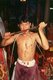 Thailand: A possessed spirit medium or <i>ma song</i> cuts his tongue with a rusty sword, The Nine Emperor Gods Festival, Chao Mae Thapthim Shrine (Taoist Chinese joss house), Wang Burapha, Bangkok (1989)