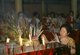 Thailand: A woman lights incense at an altar, The Nine Emperor Gods Festival, Chao Mae Thapthim Shrine (Taoist Chinese joss house), Wang Burapha, Bangkok (1989)