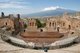 Italy: The ancient Greek theatre of Taormina with Mount Etna looming in the background, Sicily