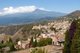 Italy: The ancient town of Taormina with Mount Etna looming in the background, Sicily