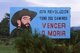 Cuba: An image of Camilo Cienfuegos (1932 - 1959) on a political poster proclaiming 'This Revolution has Two Paths: Win or Die', Cienfuegos Province, 2004