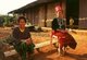 Burma / Myanmar: Lahpai Nem Ra (left), a 101 Detachment veteran (Kachin Independence Army) and former headmistress with traditionally dressed girl, Kachin State (1997)